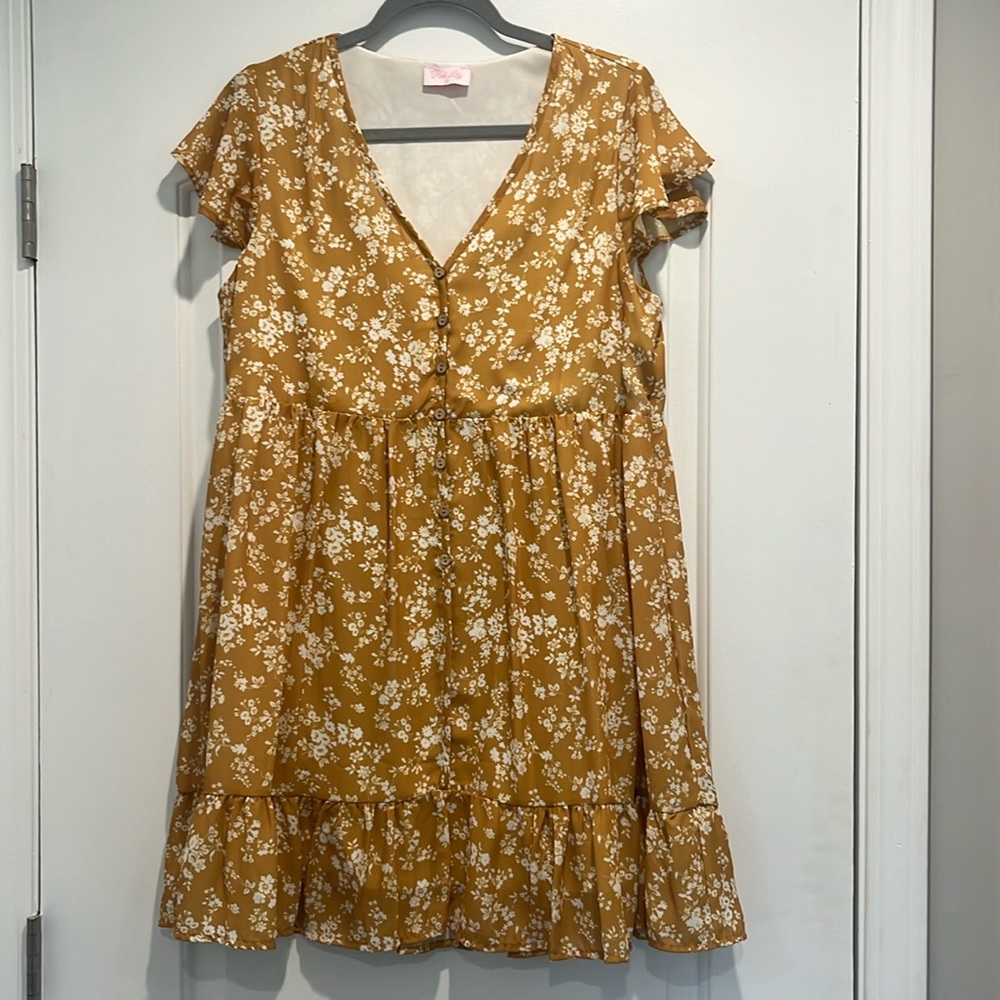 Pink Lily dress with ruffle sleeve and hem